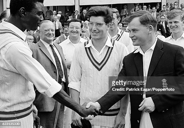 Nottinghamshire's Carlton Forbes receives his cap from captain Geoff Millman before the County Championship match between Nottinghamshire and Surrey...