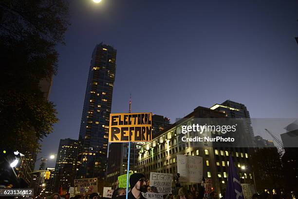 Group of Trump protesters, holding various banners, peacefully gather on 13 November in Toronto, Canada came to the streets to show solidarity with...