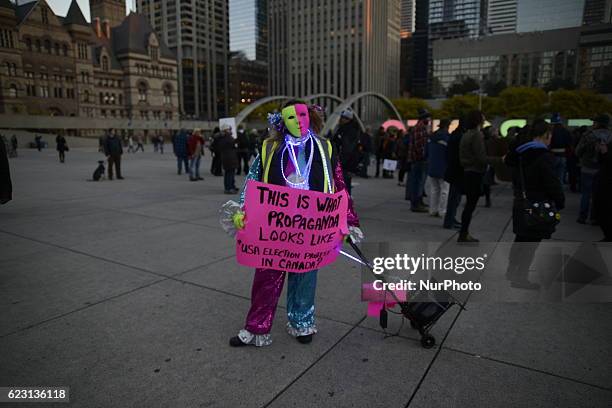 Linda an activist who doesn't approve a protest on an issue relating to USA and not Canada-wearing her mask during a rally in Toronto, Canada on 13...