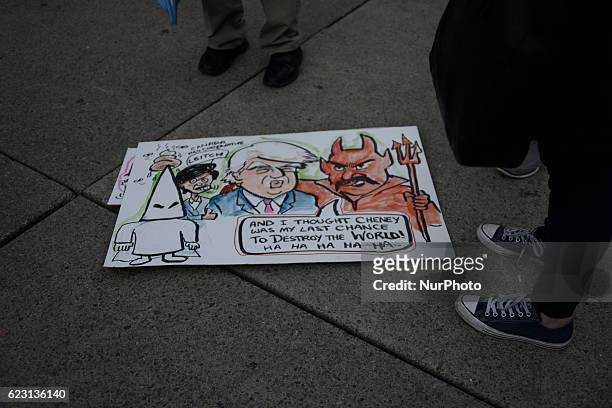 Group of Trump protesters, holding various banners, peacefully gather on 13 November in Toronto, Canada came to the streets to show solidarity with...