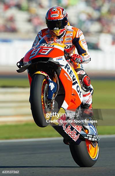 Marc Marquez of Spain and Repsol Honda Team lifts the front wheel during the MotoGP of Valencia - Race at Comunitat Valenciana Ricardo Tormo Circuit...