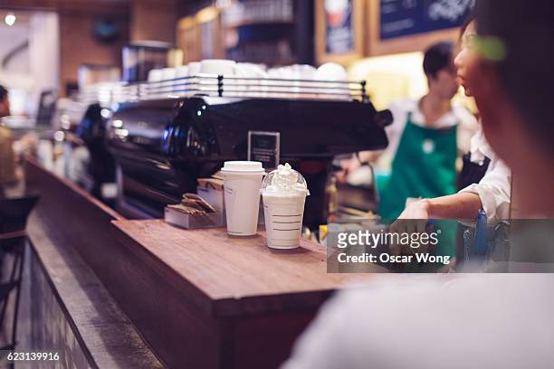 coffee in coffee counter - busy coffee shop stock pictures, royalty-free photos & images