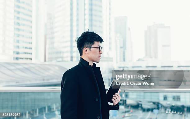 Young man looking out cityscape