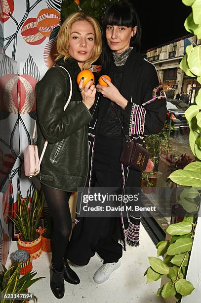 Clara Paget and Erin O'Connor take part in the Cointreau project at Liberty London on November 14, 2016 in London, England.