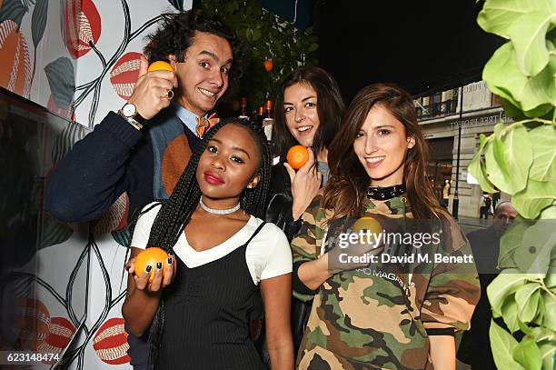 Alfred Cointreau and Tinea Taylor, Stella Asia Consonni, and Emma Chitta of Grl Pwr Gang take part in the Cointreau project at Liberty London on...