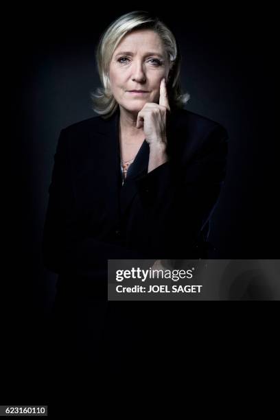 The president of the French far-right Front National party and presidential candidate for the 2017 French presidential elections Marine Le Pen poses...