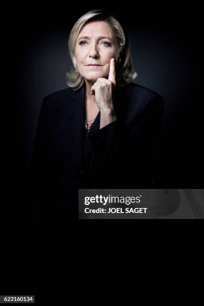 The president of the French far-right Front National party and presidential candidate for the 2017 French presidential elections Marine Le Pen poses...