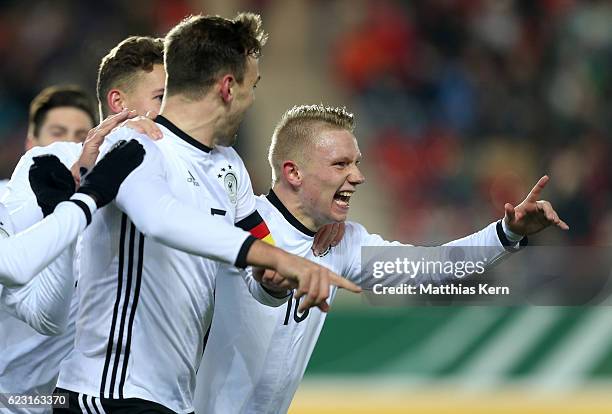 Benedikt Gimber of Germany jubilates with team mate Philipp Ochs after scoring the first goal during the U20 international friendly match between...