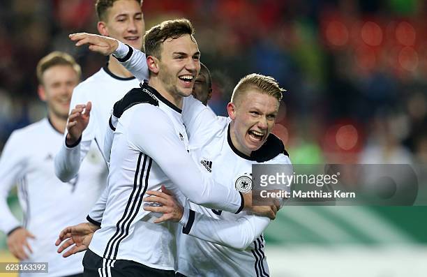 Benedikt Gimber of Germany jubilates with team mate Philipp Ochs after scoring the first goal during the U20 international friendly match between...