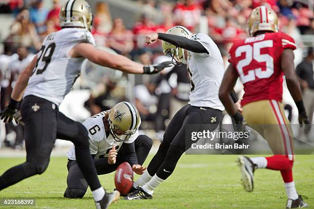 Kicker Wil Lutz of the New Orleans Saints makes the point after touchdown against the San Francisco 49ers in the first half on November, 6 2016 at...