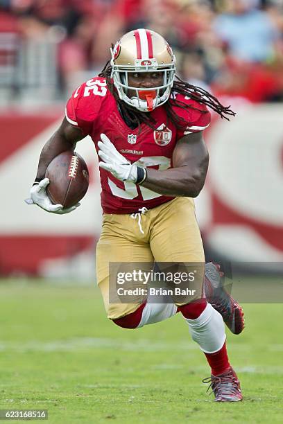 Running back DuJuan Harris of the San Francisco 49ers turns with a catch against the New Orleans Saints for an 11-yard gain in the second quarter on...