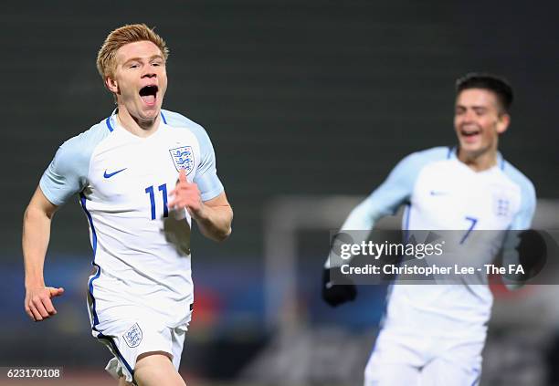 Duncan Watmore of England U21 celebrates with team mate Jack Grealish as he scores their first goal during the U21 international friendly match...