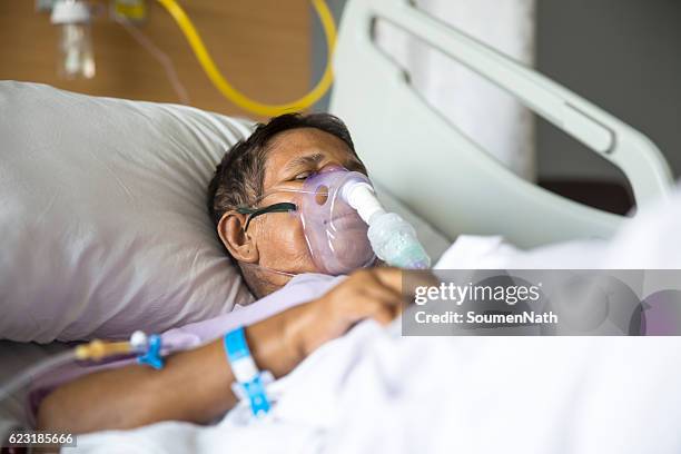 old woman with ventilator mask on hospital bed - ventilator bildbanksfoton och bilder