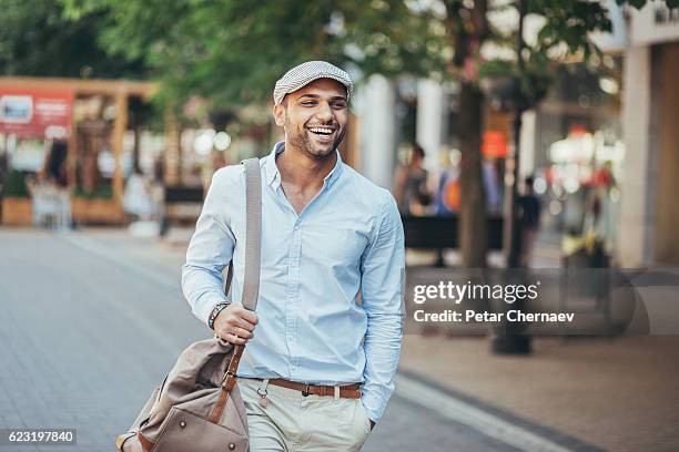 happy young man - arab man walking stock pictures, royalty-free photos & images