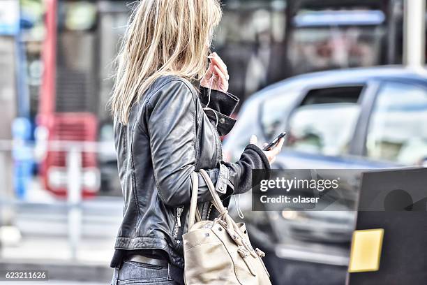 blonde woman with mobile phone in summer city stockholm, stureplan - stureplan bildbanksfoton och bilder