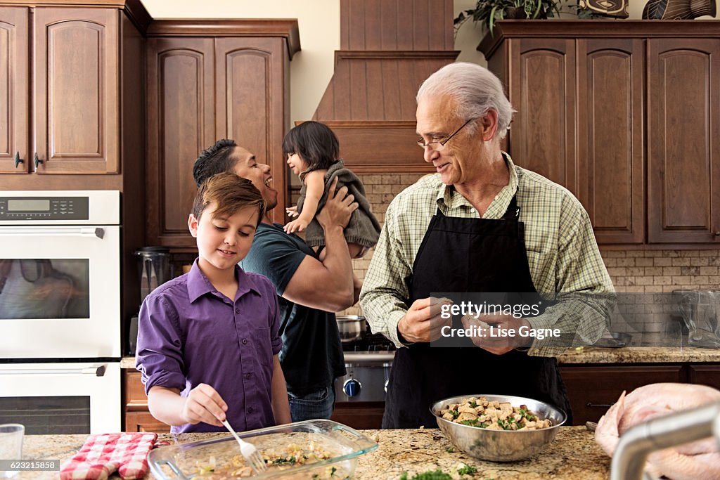 Blended Family preparing thanksgiving dinner together