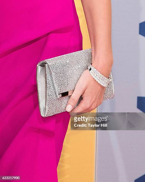 Paige White, clutch detail, attends the 50th annual CMA Awards at the Bridgestone Arena on November 2, 2016 in Nashville, Tennessee.