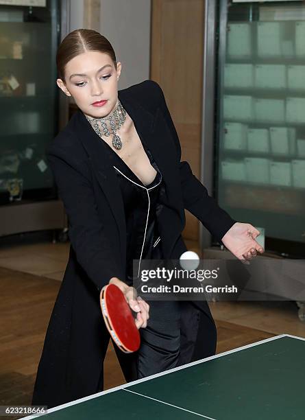 Gigi Hadid plays pingpong during a private dinner to celebrate the opening of the Stuart Weitzman London Flagship Store, at the Royal Academy of Arts...