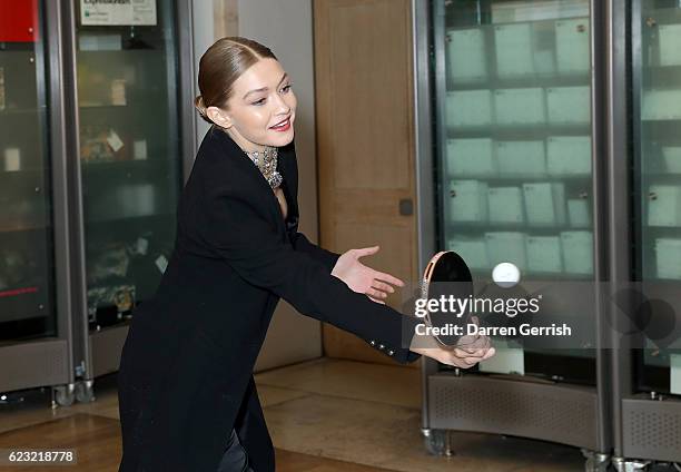 Gigi Hadid plays pingpong during a private dinner to celebrate the opening of the Stuart Weitzman London Flagship Store, at the Royal Academy of Arts...