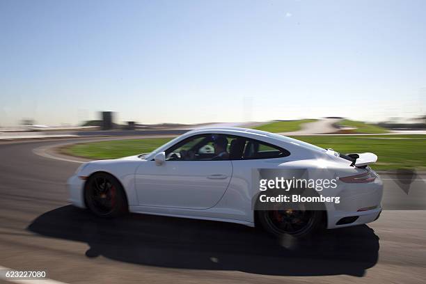 Porsche AG vehicle drives on a track at the Porsche Experience Center in Carson, California, U.S., on Monday, Nov. 14, 2016. Porsche Cars North...