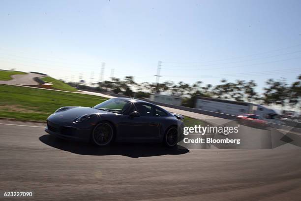 Porsche AG vehicle drives on a track at the Porsche Experience Center in Carson, California, U.S., on Monday, Nov. 14, 2016. Porsche Cars North...