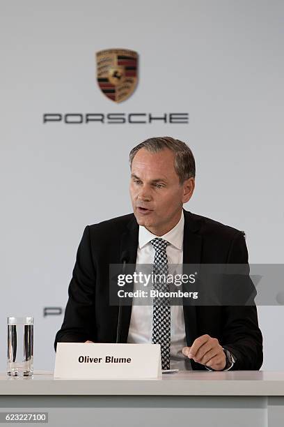 Oliver Blume, chairman of Porsche AG, center, speaks at the Porsche Experience Center in Carson, California, U.S., on Monday, Nov. 14, 2016. Porsche...