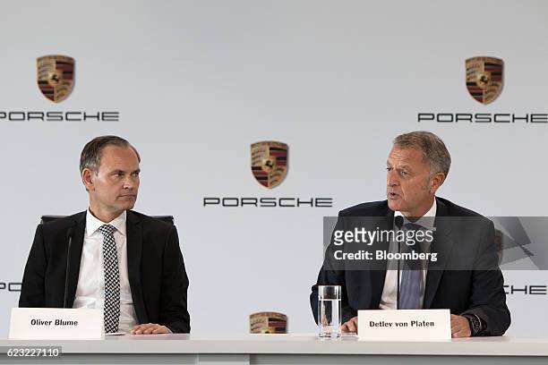 Detlev von Platen, head of sales and marketing for Porsche Automobil Holding SE, right, speaks as Oliver Blume, chairman of Porsche AG, listens at...