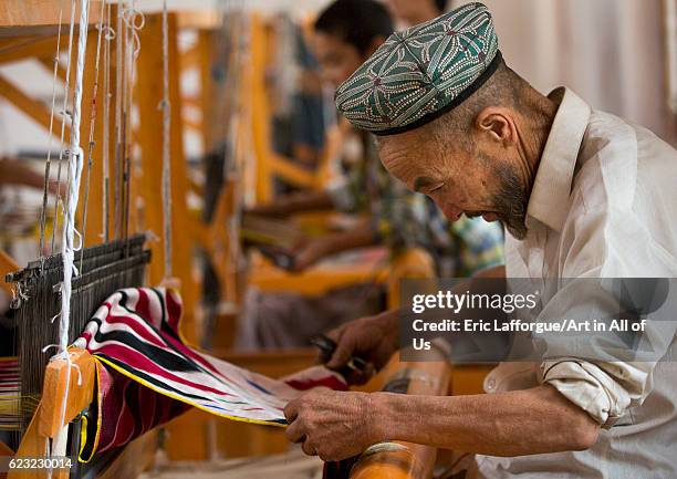 Uyghur worker in a silk factory, Hotan, Xinjiang Uyghur Autonomous Region, China on September 18, 2012 in Hotan, China.