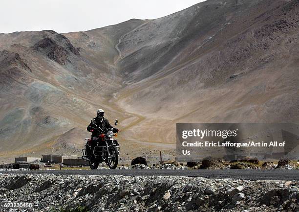 Rider near Karakul lake, Xinjiang Uyghur Autonomous Region, China on September 21, 2012 in Karakul Lake, China.