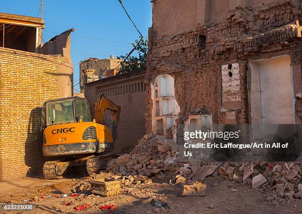 Bulldozer and demolished house, Old town of Kashgar, Xinjiang Uyghur Autonomous Region, China on September 21, 2012 in Kashgar, China.