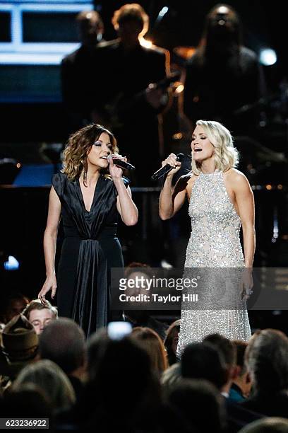 Karen Fairchild and Carrie Underwood perform onstage during the 50th annual CMA Awards at the Bridgestone Arena on November 2, 2016 in Nashville,...