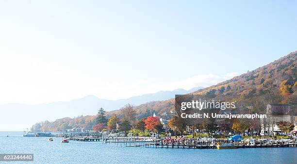 village by the chuzenji lake in nikko, japan - präfektur tochigi stock-fotos und bilder