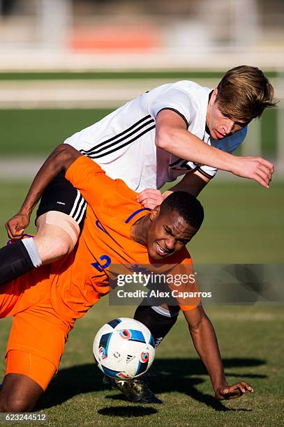 Navajo Bakboord of Netherlands fights for the ball with David Otto of Germany during the U18 international friendly match between Netherlands and...