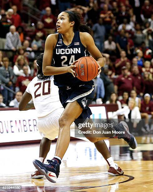 Forward Napheesa Collier of the Connecticut Huskies drives to the basket against Forward Shakayla Thomas of the Florida State Seminoles during the...