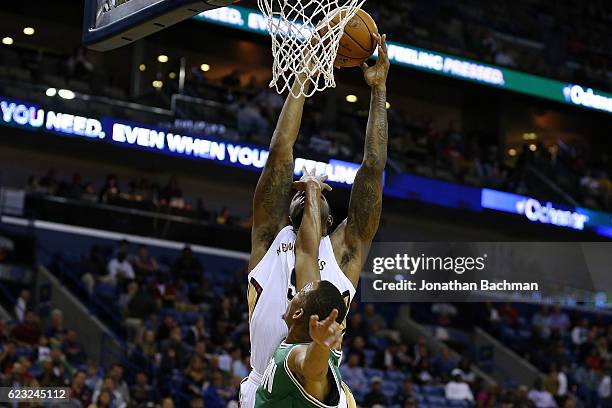 Terrence Jones of the New Orleans Pelicans shoots over Avery Bradley of the Boston Celtics during the second half of a game at the Smoothie King...