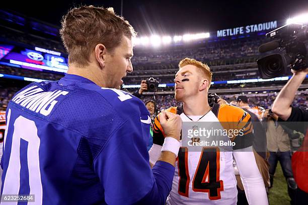 Eli Manning of the New York Giants shakes hands with Andy Dalton of the Cincinnati Bengals after the game at MetLife Stadium on November 14, 2016 in...