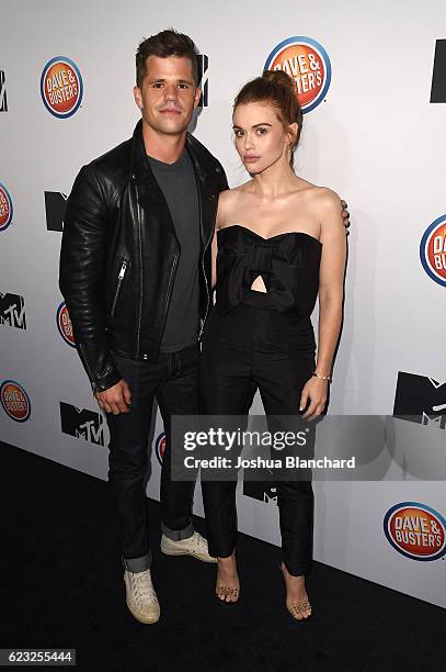 Charlie Carver and Holland Roden arrive at MTV's "Teen Wolf" and "Sweet/Vicious" Premiere Event on November 14, 2016 in Los Angeles, California.