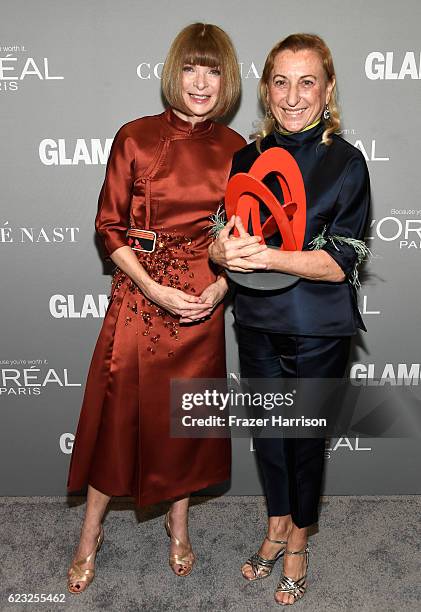 Vogue magazine Editor-in-Chief Anna Wintour and honoree Muccia Prada pose with an award at Glamour Women Of The Year 2016 at NeueHouse Hollywood on...