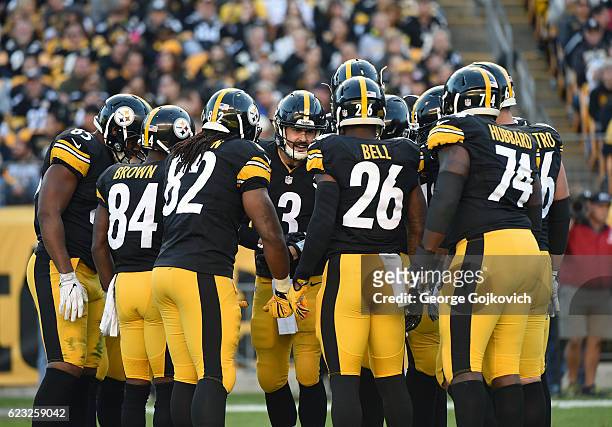 Quarterback Landry Jones of the Pittsburgh Steelers huddles with the offense, including tight end Xavier Grimble, wide receiver Antonio Brown, tight...