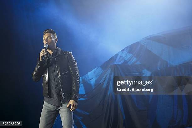 Television host Ryan Seacrest speaks before the Ford Motor Co. EcoSport crossover sport utility vehicle is revealed on stage during the Go Small,...