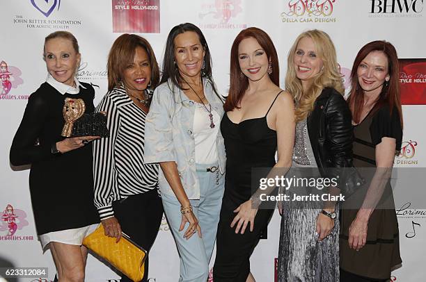 Actress Amy Yasbeck poses with friends at An Enchanted Evening With Mario AC Della Casa - Fundraiser For John Ritter Foundation And Beverly Hills...