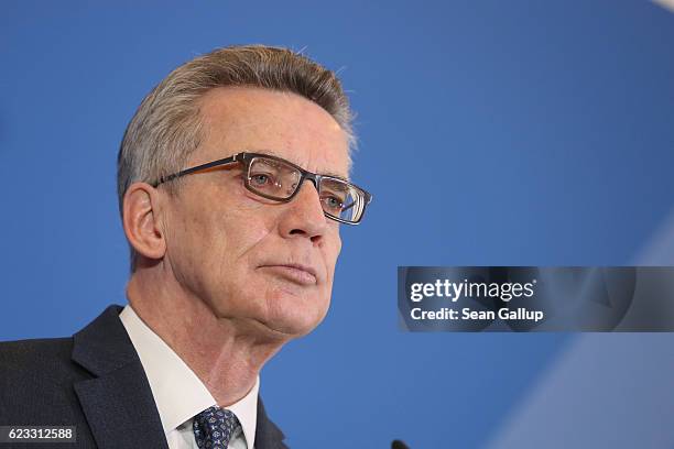 German Interior Minister Thoma de Maiziere speaks to the media to announce that authorities launched 200 raids against Islamists across Germany today...