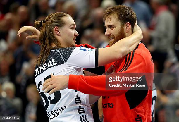 Andreas Wolff, goalkeeper of Kiel celebrate with team mate Lukas Nilsson after the DKB HBL Bundesliga match between THW Kiel and SG...