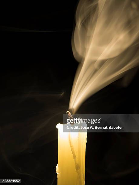 he guards newly extinguished with tracks of smoke on a black bottom - candle vigil stock pictures, royalty-free photos & images