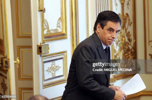 France's Prime minister François Fillon arrives to give a press conference on January 14, 2012 in Paris, a day after the rating agency Standard and...