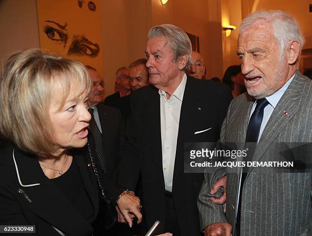 French actors Alain Delon and Jean-Paul Belmondo speak with Martine Monteil a former general director of French judicial police during the award...