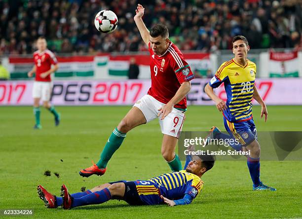 Adam Szalai of Hungary is tackled by Marc Vales of Andorranext tof Max Llovera od Andorra during the FIFA 2018 World Cup Qualifier match between...