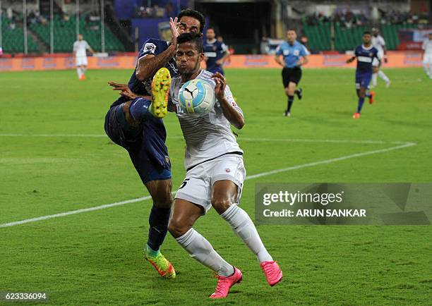 Chennaiyin FC defender Mehrajuddin Wadoo vies for the ball with FC Pune City's defender Narayan Das during the Indian Super League football match...