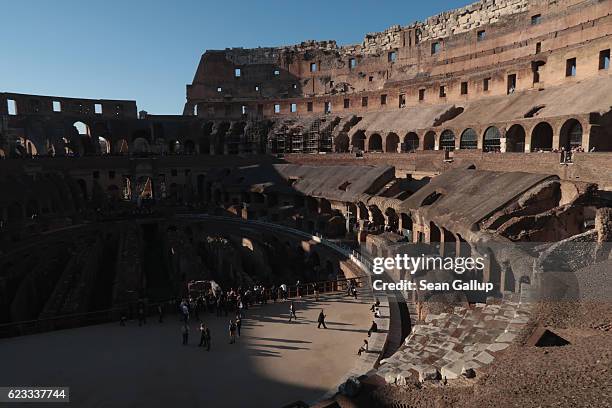 Visitors walk inside the ruin of the Colosseum on October 28, 2016 in Rome, Italy. Rome is among Europe's major tourist destinations.