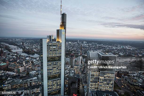 The Frankfurt banking district in the Blue Hour. The photo shows the head office of Commerzbank AG and a part of Frankfurt with the river Main. Main.